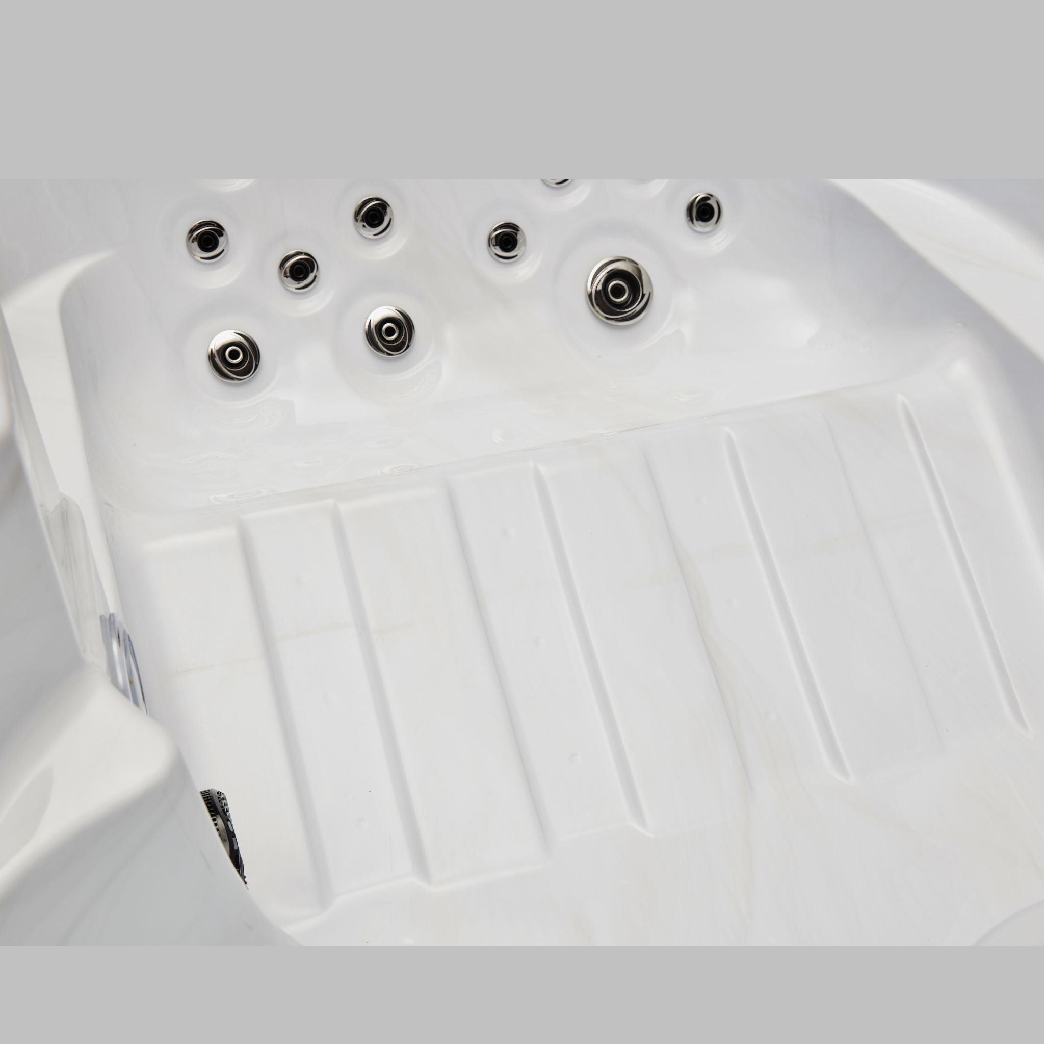 Relaxing in the luxurious Regal 4 Person Hot Tub Spa with 39 Jets, featuring a Pearl Grey Interior and an Ozonator WS-292 for ultimate comfort and rejuvenation