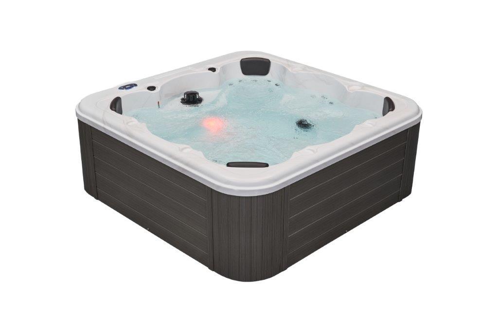Relaxing in the luxurious Denali 7 Person Hot Tub Spa with 64 Jets & bluetooth WS-299