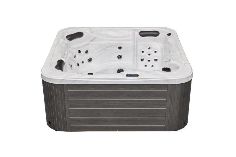 Relaxing in the luxurious Estes 5 Person Hot Tub Spa with 52 Jets Dual Lounger WS-594D