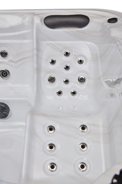 Relax and unwind in the spacious Estes 5 Person Hot Tub Spa with 52 Jets and a Dual Lounger WS-594D