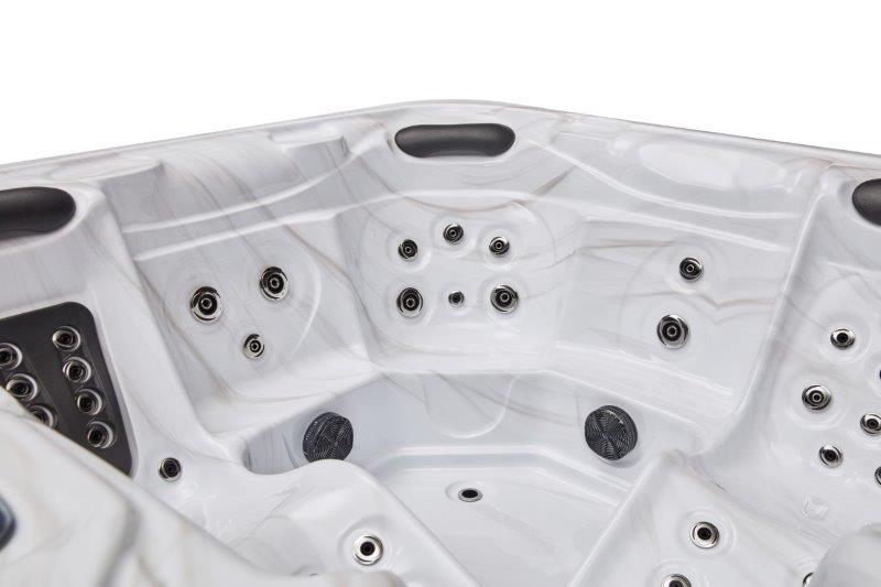 Relaxing in the luxurious Estes 5 Person Hot Tub Spa with 52 Jets Dual Lounger WS-594D