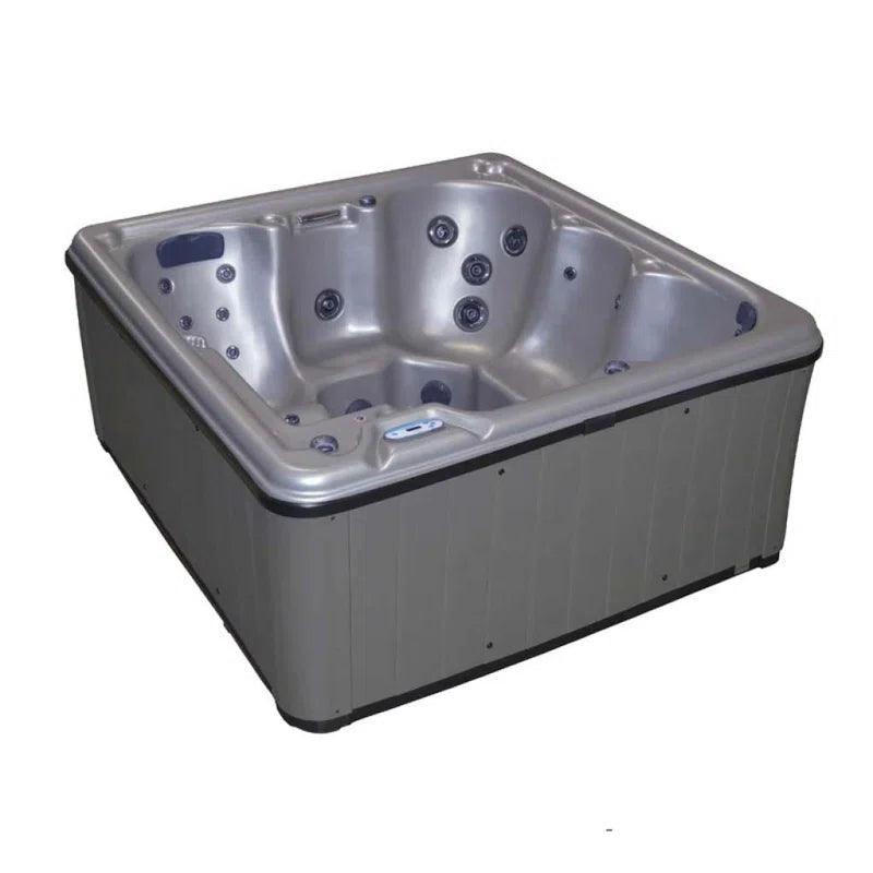 Cyanna Valley Supreme 6-Person 32-Jet Square Hot tub Spa with Ozonator in a luxurious outdoor setting, surrounded by greenery and flowers