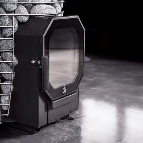 Top view of the HUUM HIVE Flow 10kW Wood Sauna Stove, showcasing the chimney connection