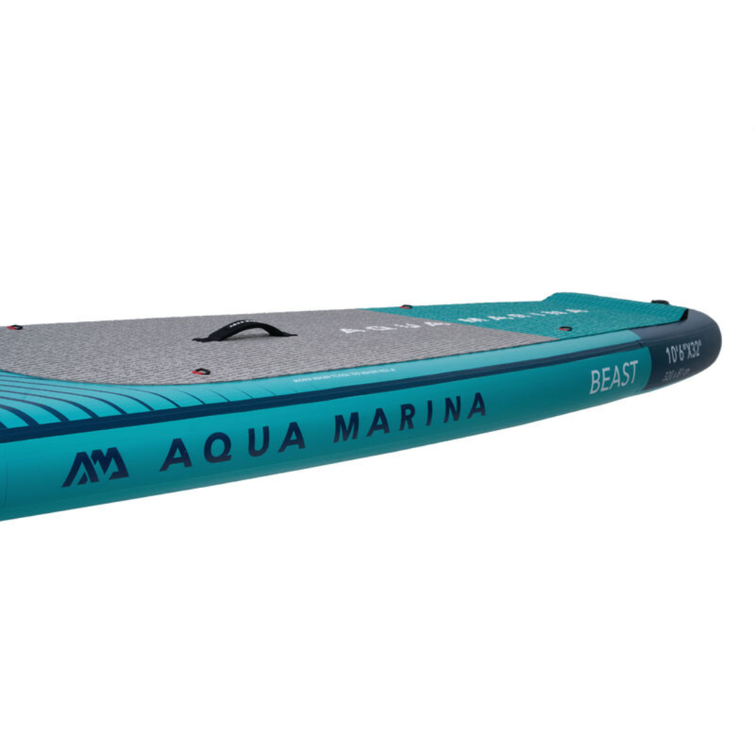 Aqua Marina Beast 10'6 All Water Inflatable SUP Board being used by a female paddler with paddle in hand