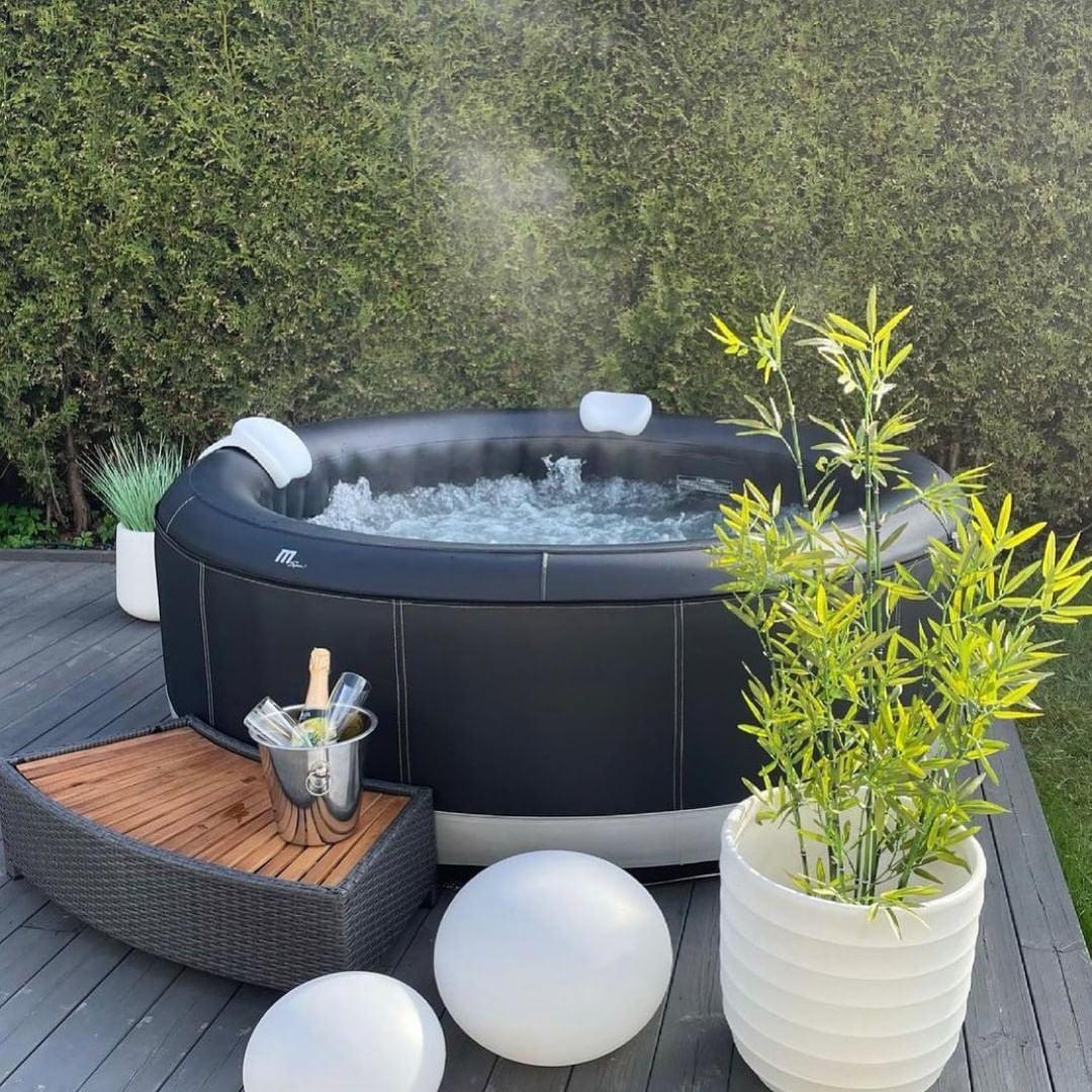 Mspa Camaro 6 Person Hot Tub Spa P-CAO63 in a luxurious outdoor setting with greenery and sunshine