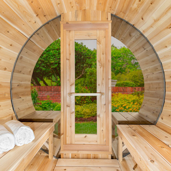  Wooden barrel sauna with large window for natural light and views 