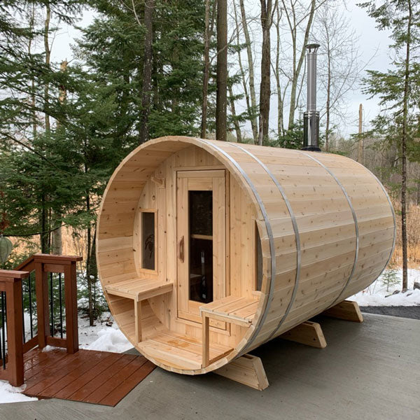 Spacious Tranquility 6-8 Person Outdoor Barrel Sauna with Porch, perfect for relaxation and socializing in the comfort of your own home