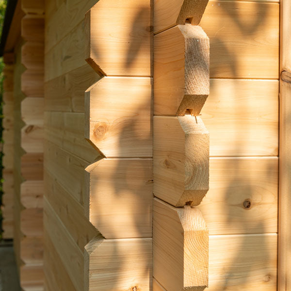 Rustic cedar outdoor sauna with separate changing room and seating for 6 people