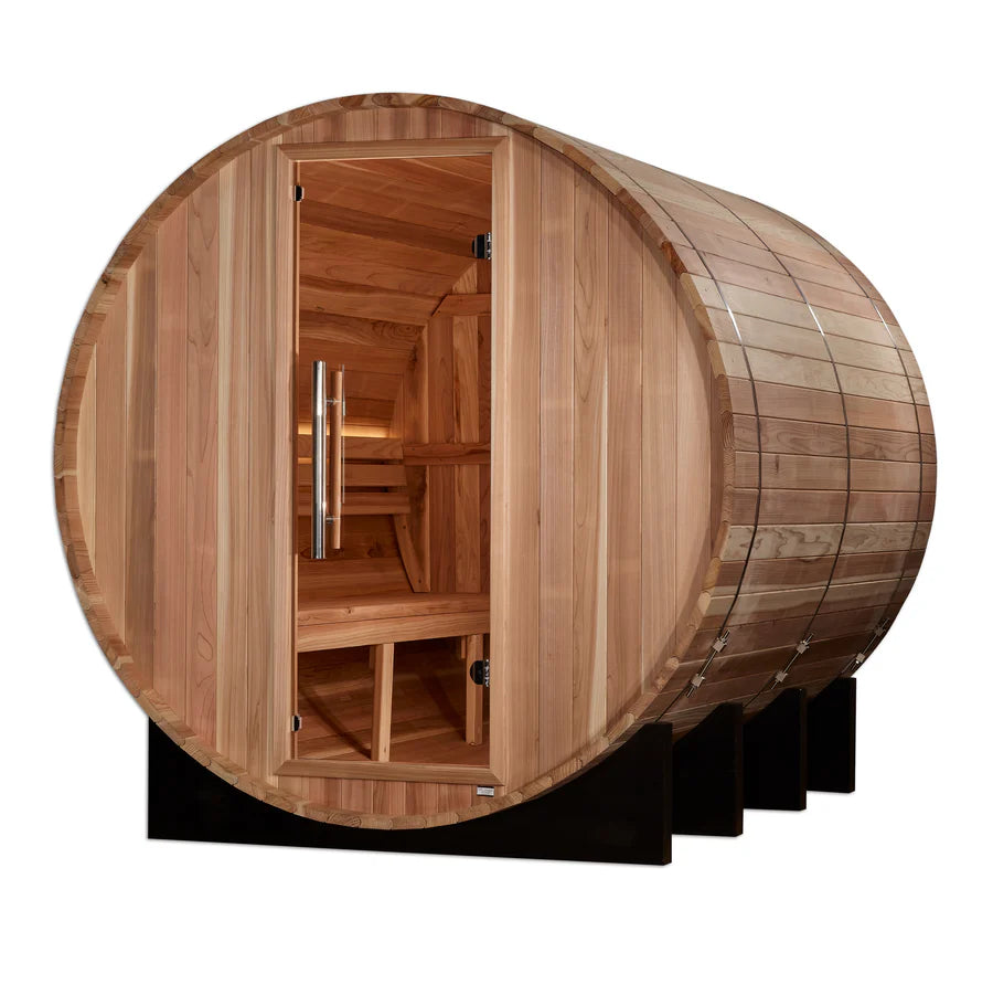 Golden Designs Klosters 6 Person Barrel Outdoor Traditional Sauna GDI-B006-01 in natural wood setting surrounded by trees and greenery